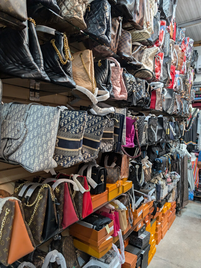 A wall of handbags.